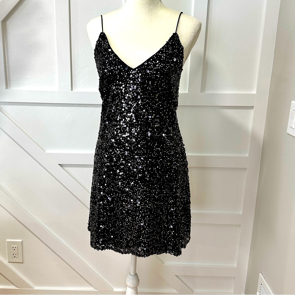 Sexy, sequined black dress.